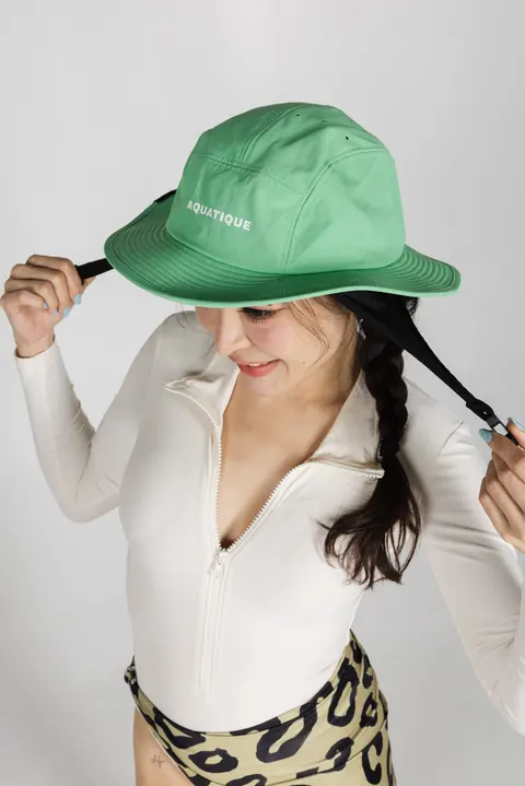 AQUATIQUE Avocado bucket hat, worn in the studio