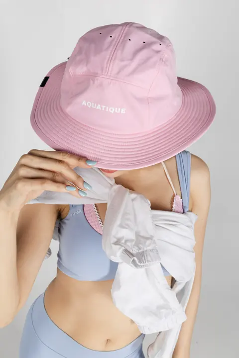 AQUATIQUE Pink bucket hat, worn in the studio