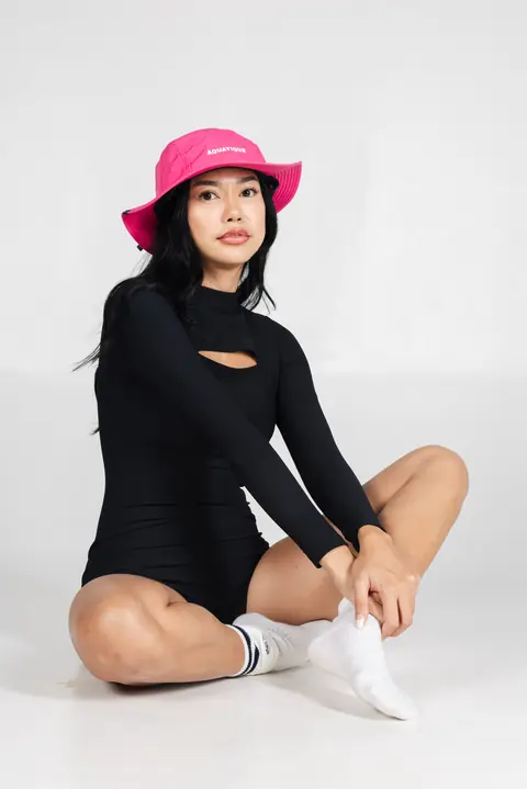 AQUATIQUE Shock Pink bucket hat, worn in the studio